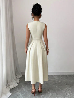 Back view of a sleeveless white midi dress with a fitted waist and buttoned design
