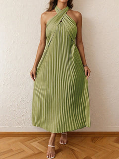 Green pleated halter neck midi dress with tied neckline and no stretch polyester fabric.