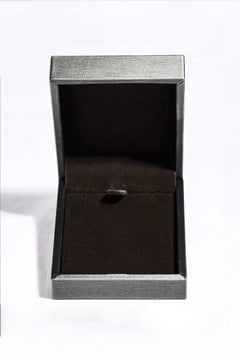 Moissanite square pendant necklace in sterling silver displayed in an open box.
