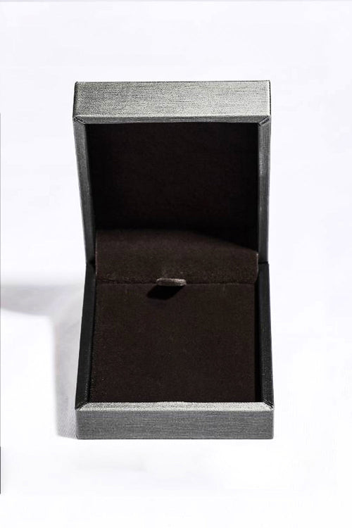 Moissanite square pendant necklace in sterling silver displayed in an open box.