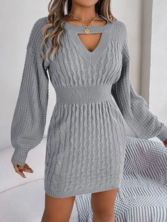 Gray cable-knit cutout round neck slit sweater dress with long sleeves and fitted waist.