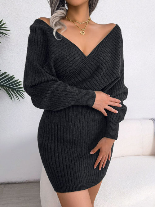 Black rib-knit dolman sleeve sweater dress with surplice neckline and mini A-line hem