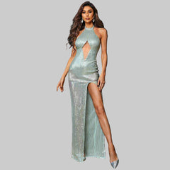 Woman wearing a mint Mackenzie Cut Out halter gown with front cut out and thigh-high slit