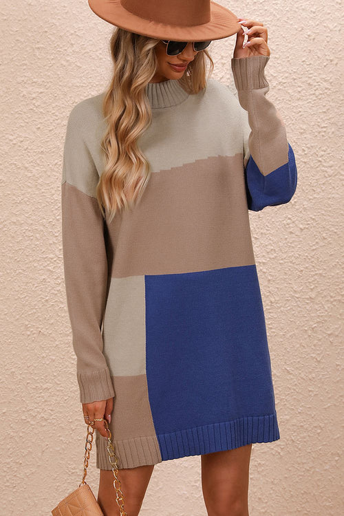 Woman wearing casual color block mock neck sweater dress with dropped shoulders and long sleeves