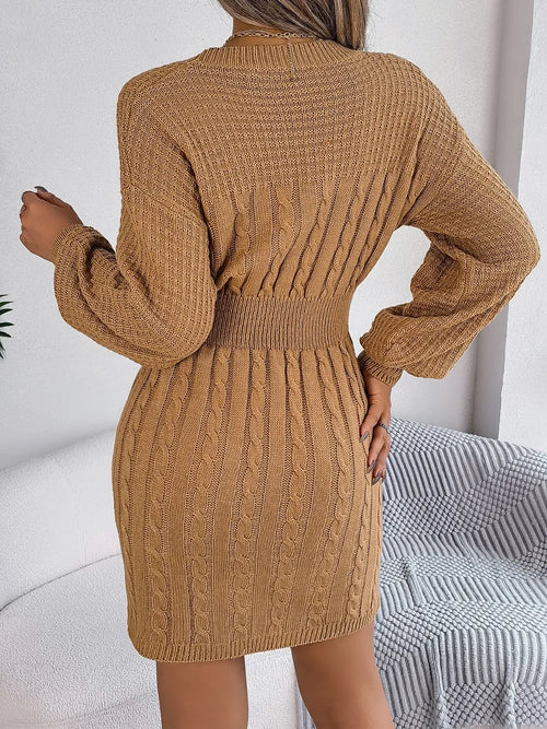 back view of brown cable-knit cutout round neck slit sweater dress with long sleeves and fitted waist
