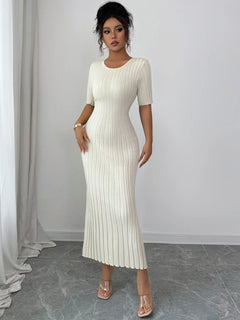Woman wearing white ribbed round neck short sleeve sweater dress with moderate stretch reaching mid-calf
