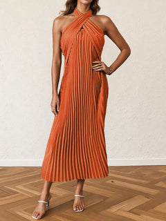 Orange pleated halter neck midi dress with tied detail and no stretch, made of 100% polyester.