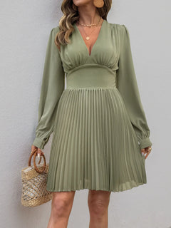 Olive green pleated long sleeve V-neck dress with slightly stretchy polyester fabric and zipper closure