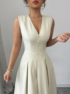 Elegant V-neck sleeveless midi dress with button detailing and pleated skirt in cream color