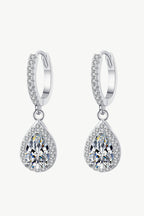 Pair of 1-inch moissanite teardrop earrings with 2 carat total weight, 925 sterling silver and rhodium plating.