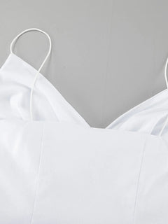 White ruffled V-neck maxi dress with thin straps and lined 100% cotton fabric.