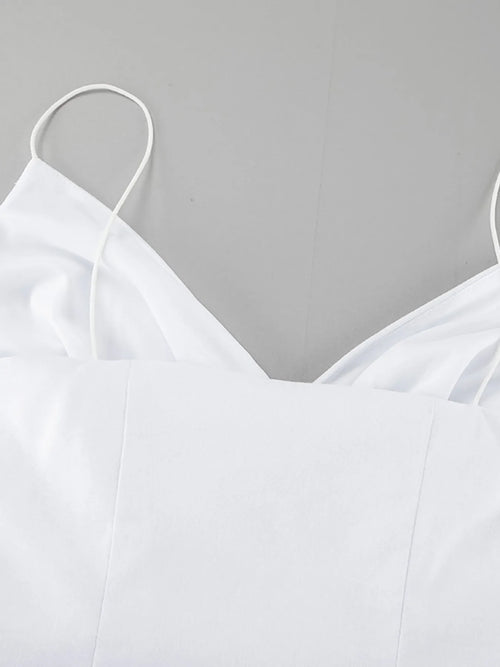 White ruffled V-neck maxi dress with thin straps and lined 100% cotton fabric.