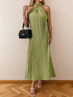 Green pleated halter neck midi dress with tied neckline and no stretch polyester fabric.