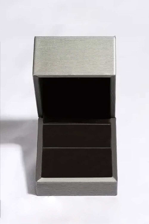 Open silver jewelry box with black velvet interior for Stuck On You 4 Carat Moissanite stud earrings