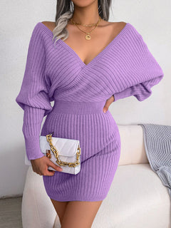 Purple rib-knit dolman sleeve sweater dress with surplice neckline and A-line hem, casual mini length.