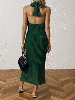 Green pleated halter neck midi dress with tied back detail and no stretch polyester fabric