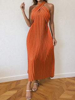 Orange pleated halter neck midi dress with tied detail and no stretch polyester fabric.