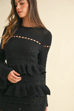 Long sleeve knit midi dress with tiered ruffle details.