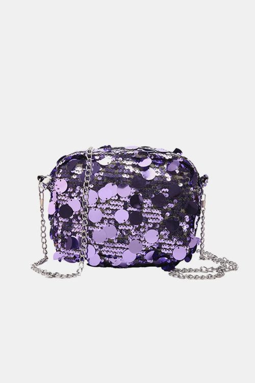 Small sequin chain shoulder bag in purple polyester with silver chain strap.